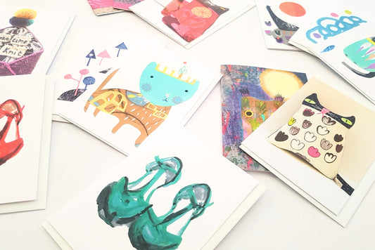 Selection of colourful greeting cards by UK indie designer, arranged in a grid format.