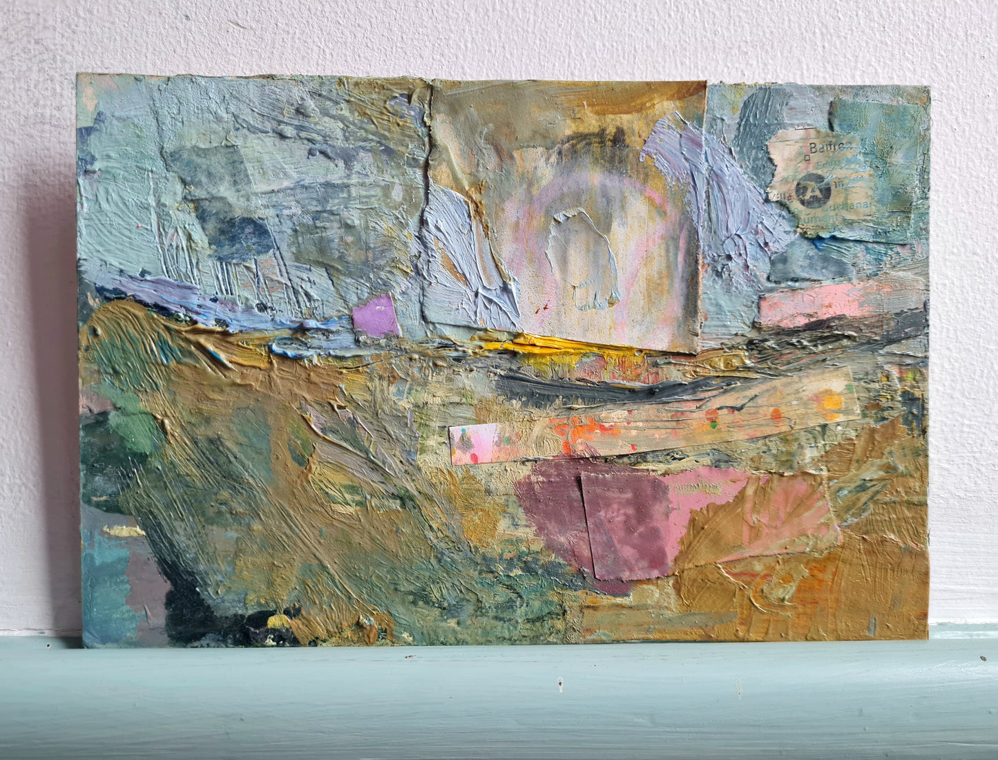 Abstract painting with textured brushstrokes on a white wall