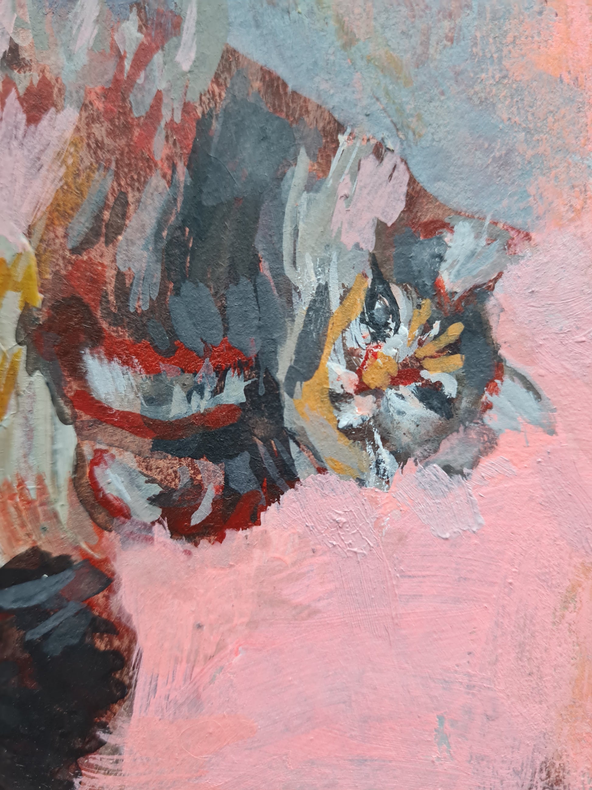 Detail of a cat painting showing the face and paws