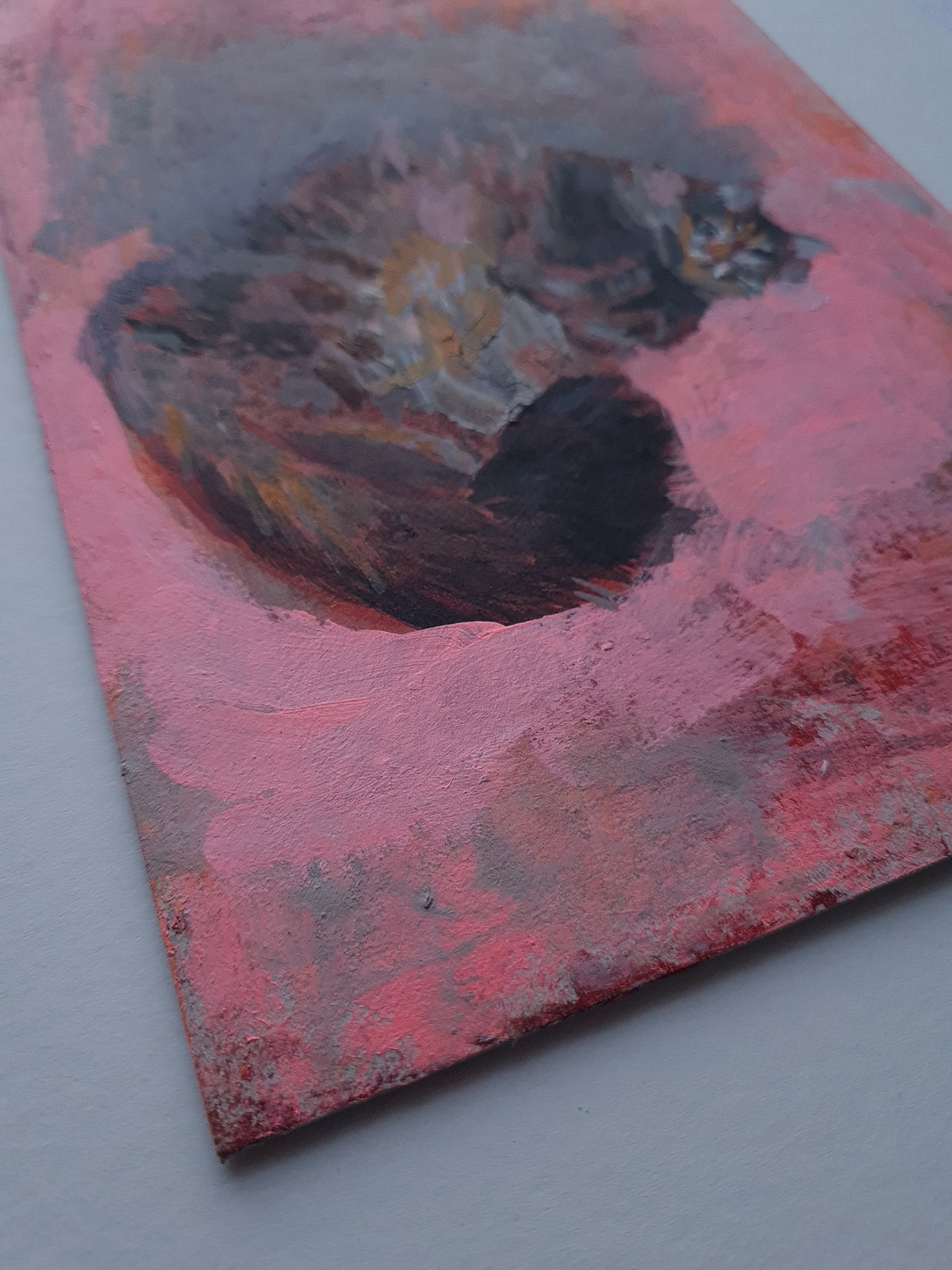 Detail of the bottom left corner of a cat painting.
