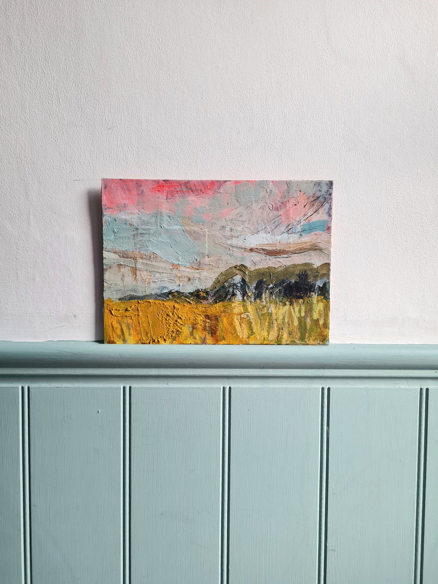 Abstract landscape painting on a white wall
