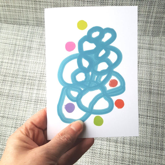 Hand holding abstract roes and floats greeting card