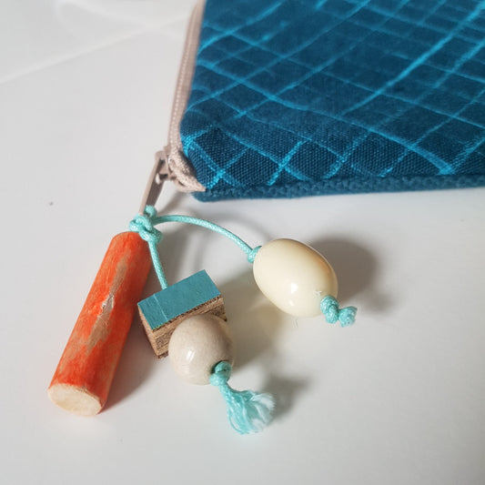 Zipper-pull embellishment inspired by rope and floats
