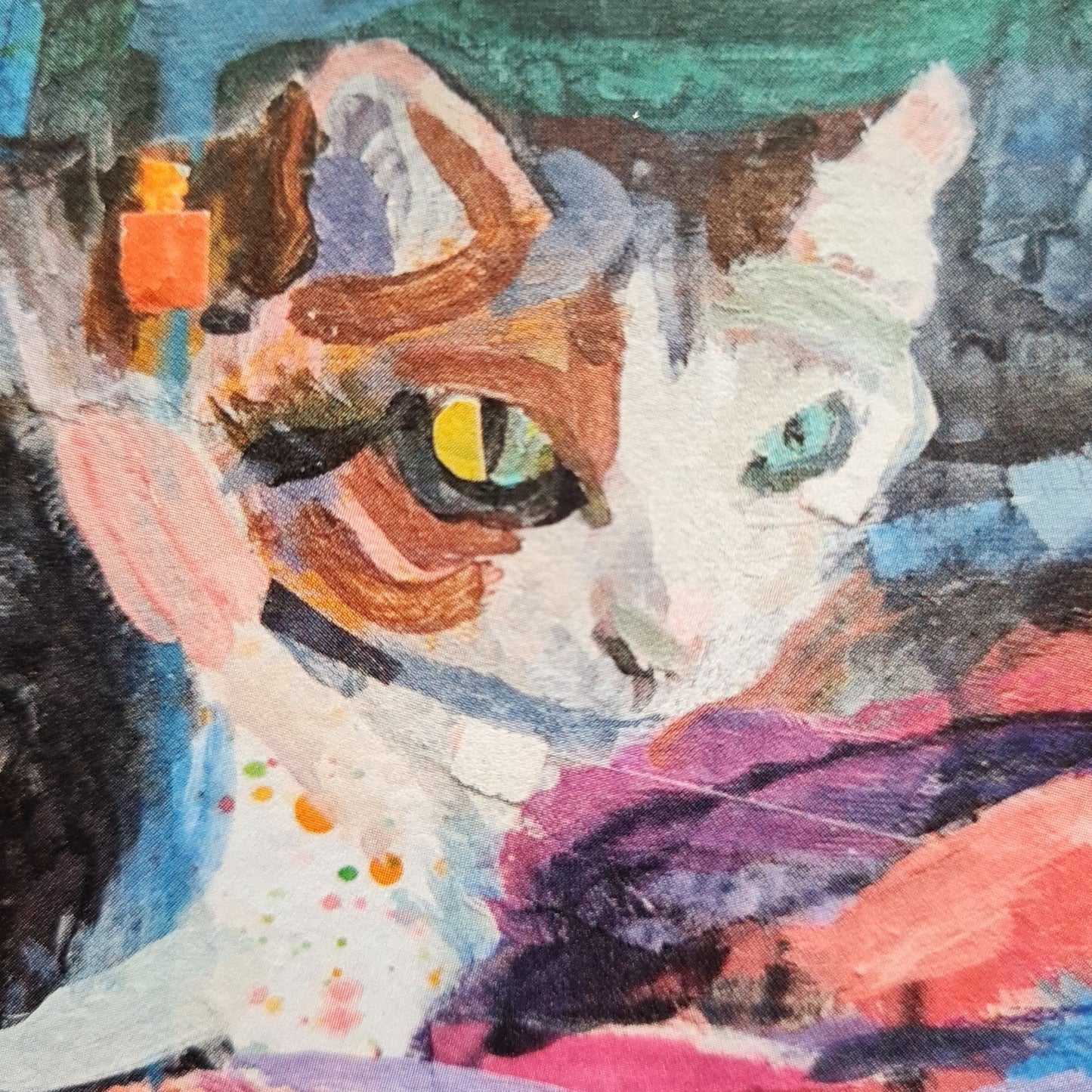 Close-up of abstract painting of a cat with colourful splashes