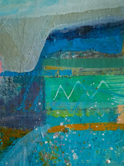 Abstract art detail with a mix of blue, green, and orange colours.