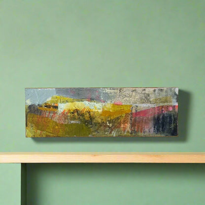 Small mixed media landscape painting against a green background. AI