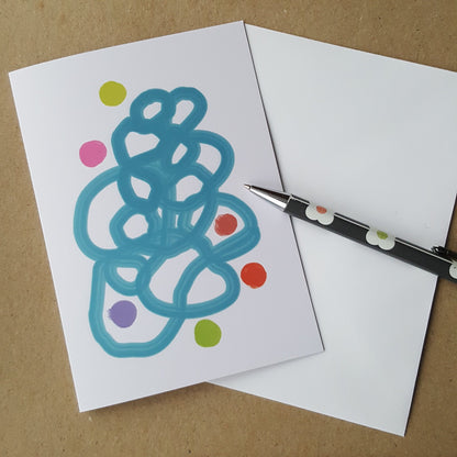 greeting card on desk with white envelope and pencil